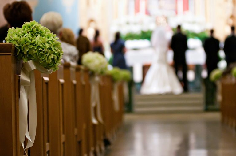 Church aisle decorated for a wedding