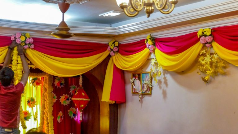 House decorated with marigold garlands