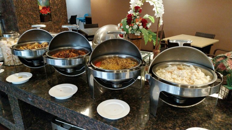 Chafing dishes on a buffet counter