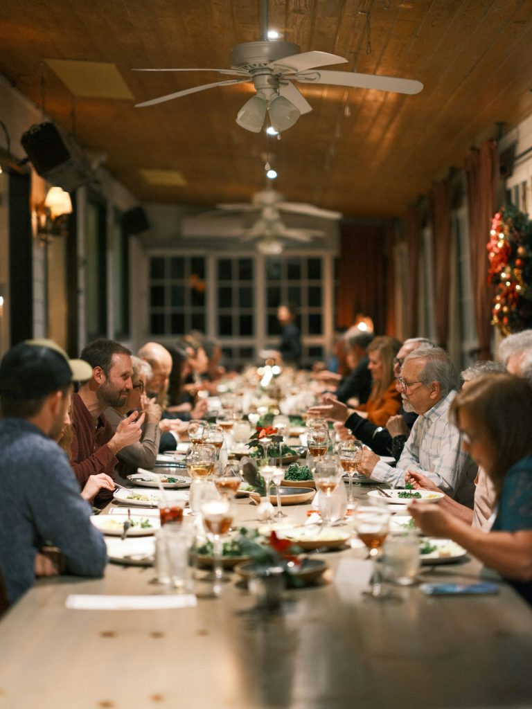 Guests dining at a long banquet table