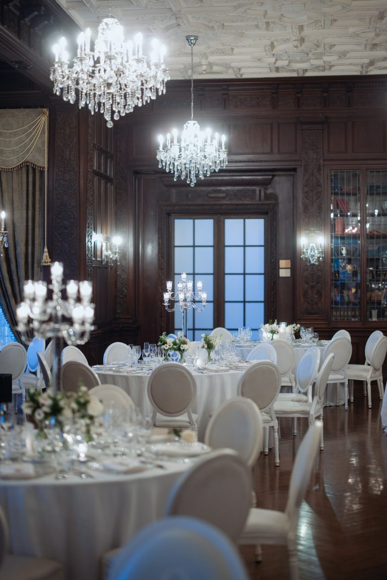 Banquet hall with chandeliers and round tables