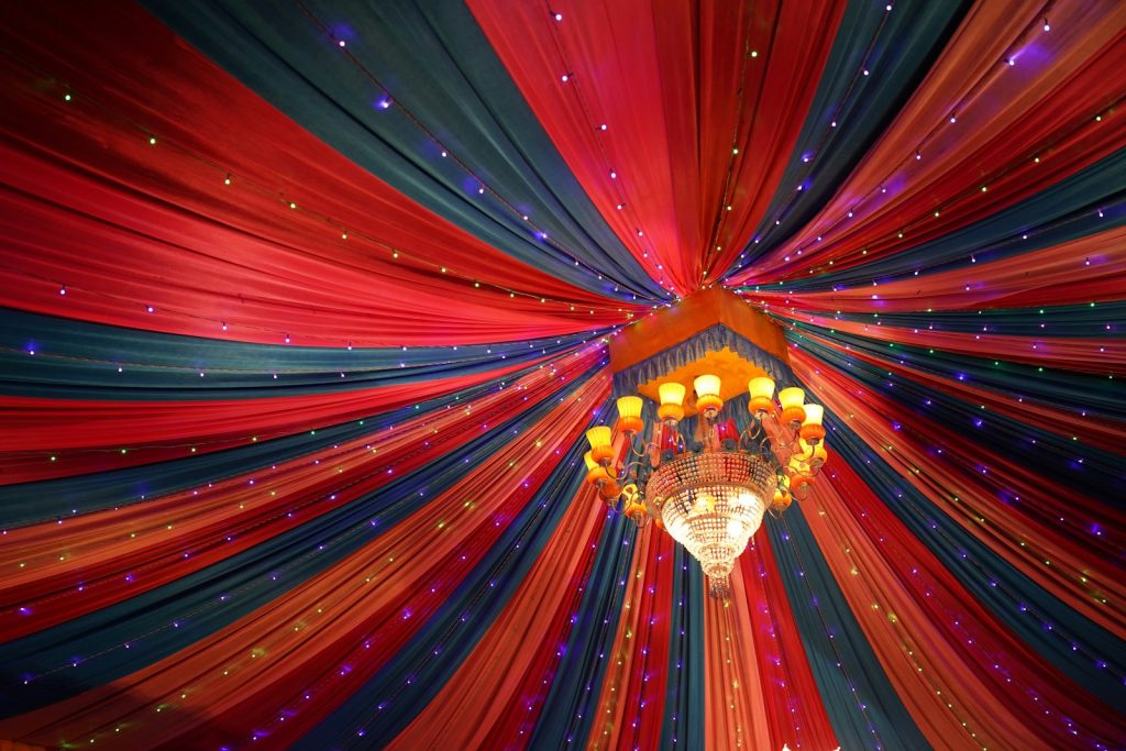 Hall with draped canopy and chandelier