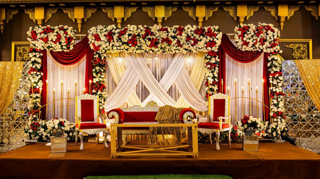 Floral wedding stage with couple seating