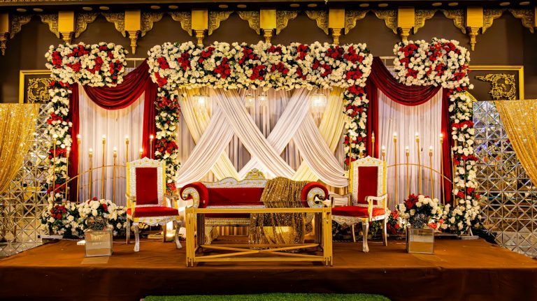 Floral wedding stage with couple seating