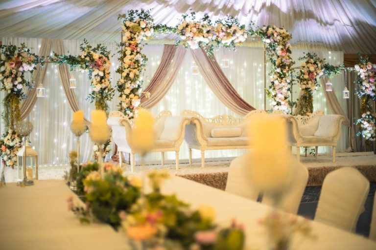 Couple seating framed with flowers