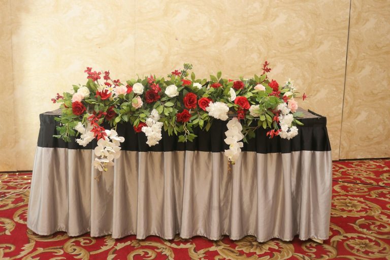 Head table decorated with flowers